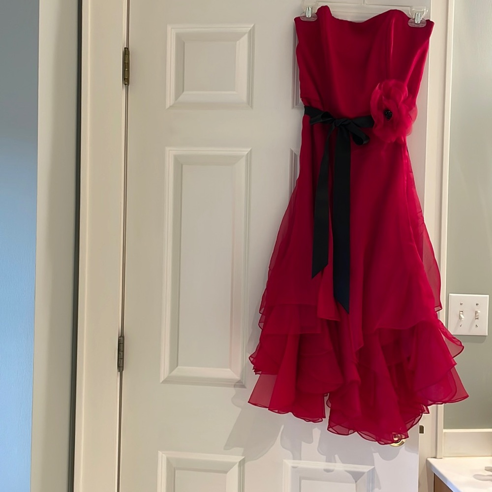 Exquisite flouncy Shani strapless cocktail dress with layered chiffon skirt.